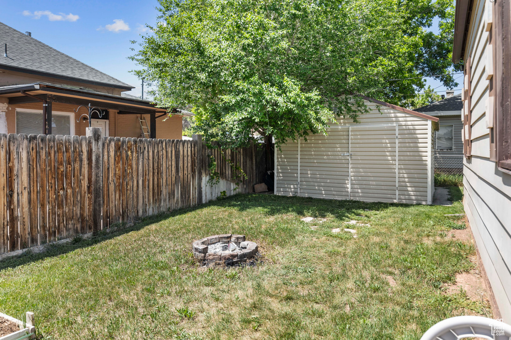 View of yard featuring a fire pit