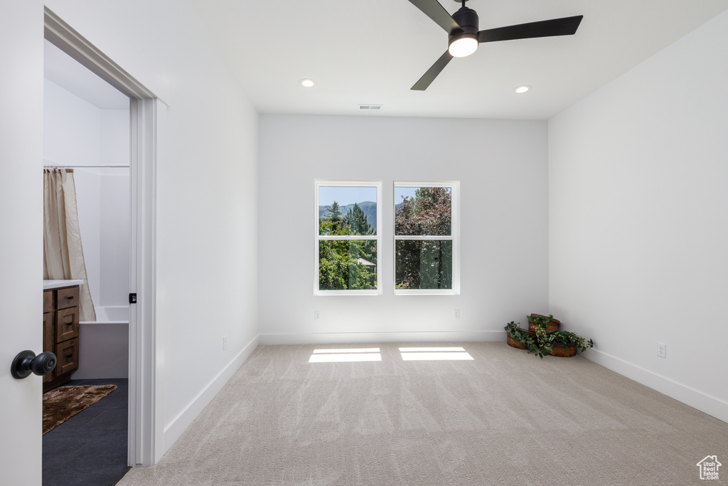 Unfurnished bedroom featuring carpet flooring, baseboards, recessed lighting, and a ceiling fan