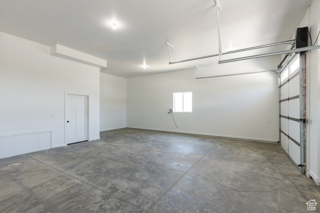 Garage featuring baseboards