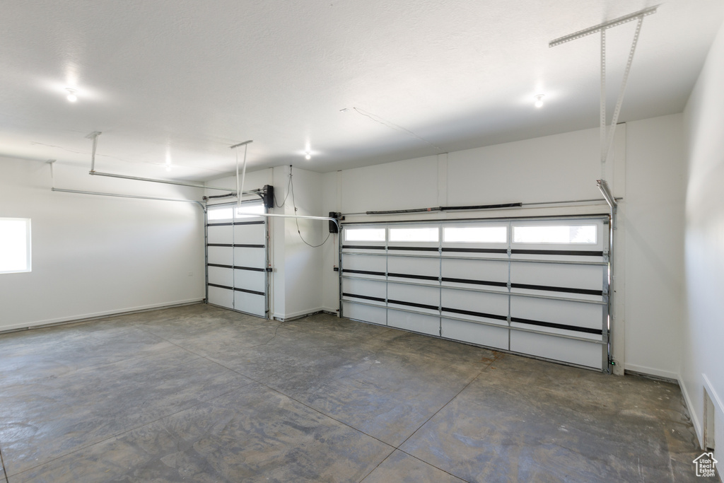 Garage featuring baseboards