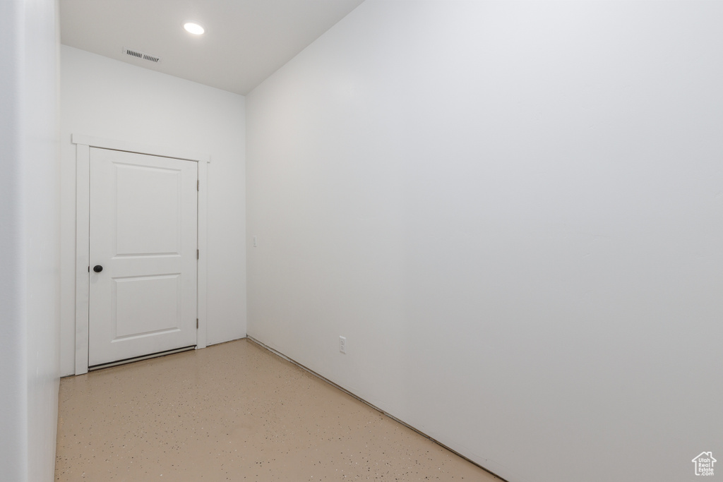 Empty room featuring recessed lighting