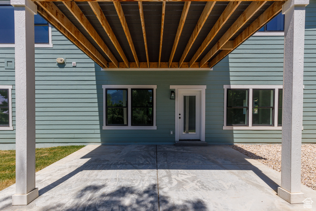 Property entrance with a patio area