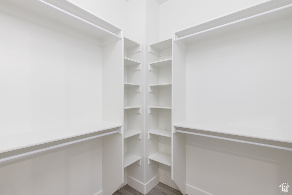 Spacious closet featuring wood finished floors