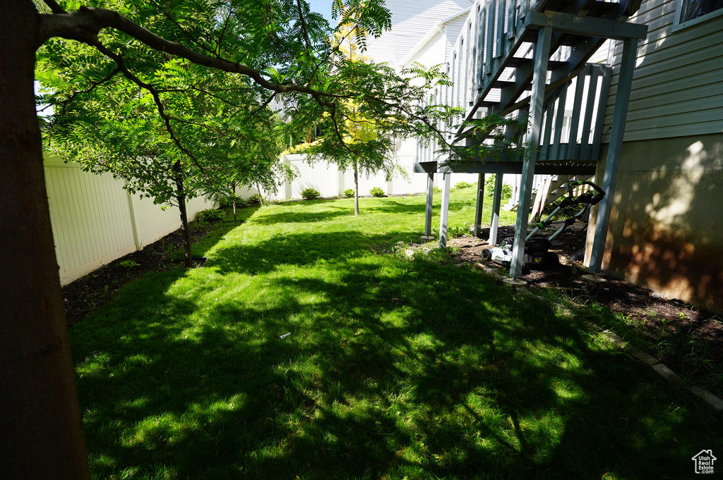 View of yard with a wooden deck