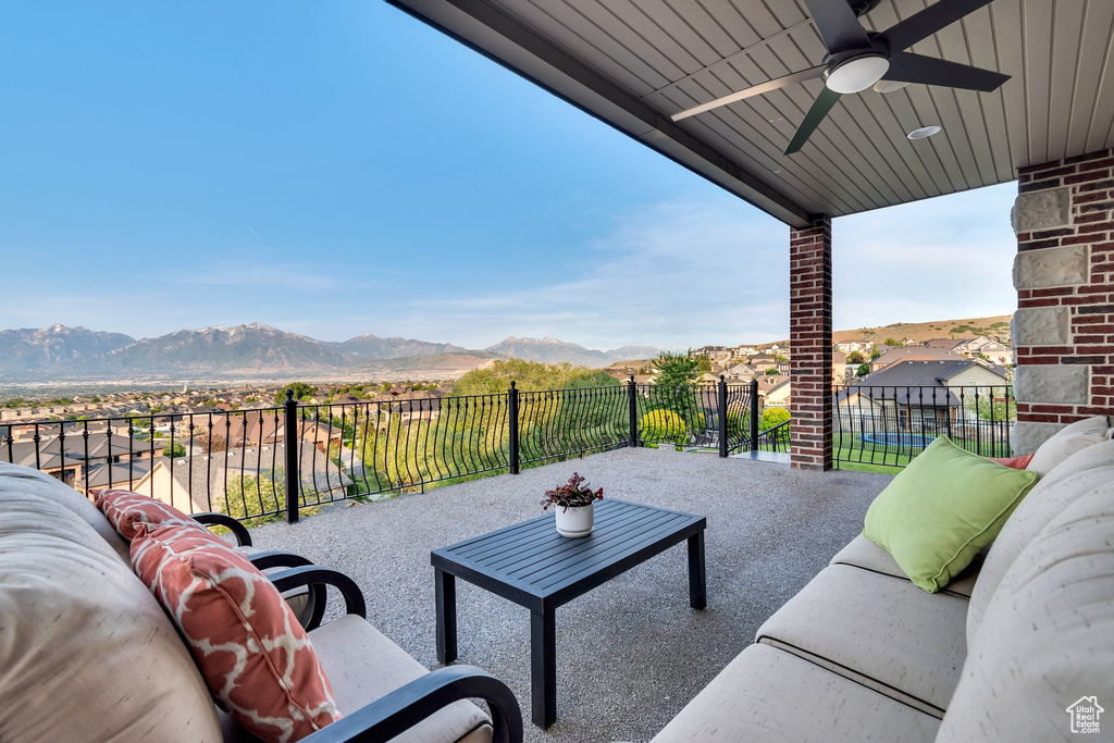 View of patio / terrace featuring outdoor lounge area, a mountain view, and ceiling fan