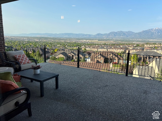 Balcony featuring a mountain view and a residential view