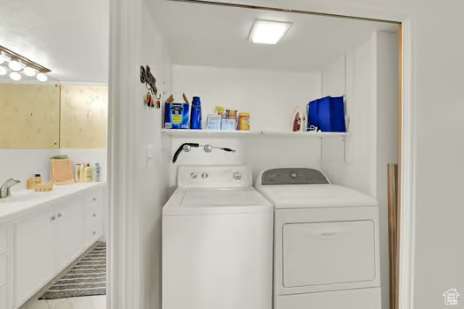 Laundry room with washing machine and clothes dryer