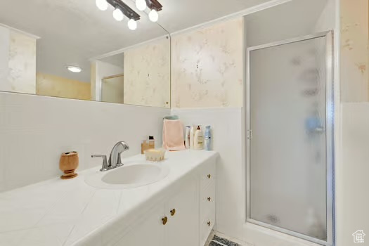 Full bath featuring vanity and a stall shower