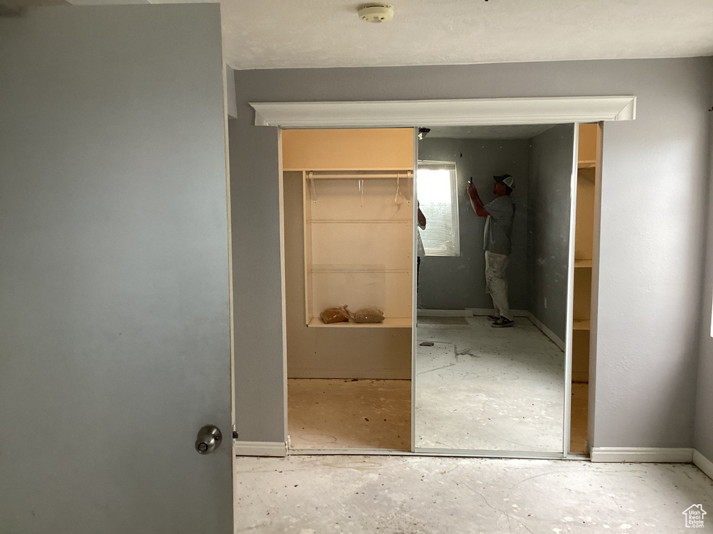 Corridor featuring baseboards