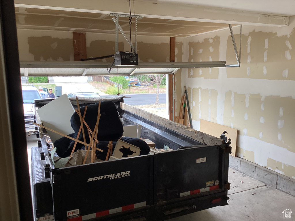 Garage featuring a garage door opener