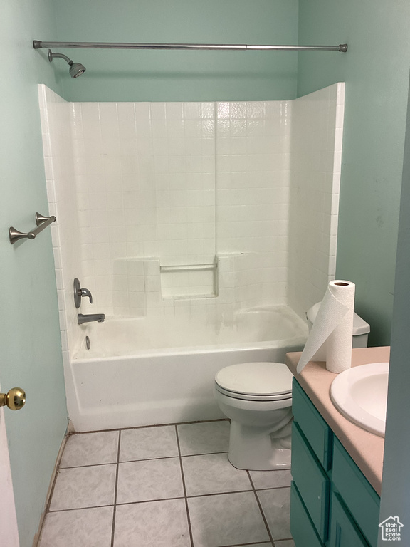 Bathroom featuring vanity, toilet, tub / shower combination, and tile patterned floors