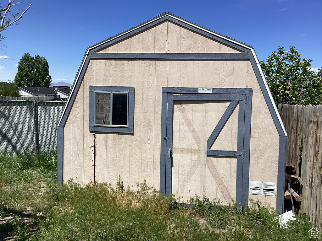 View of shed featuring a fenced backyard