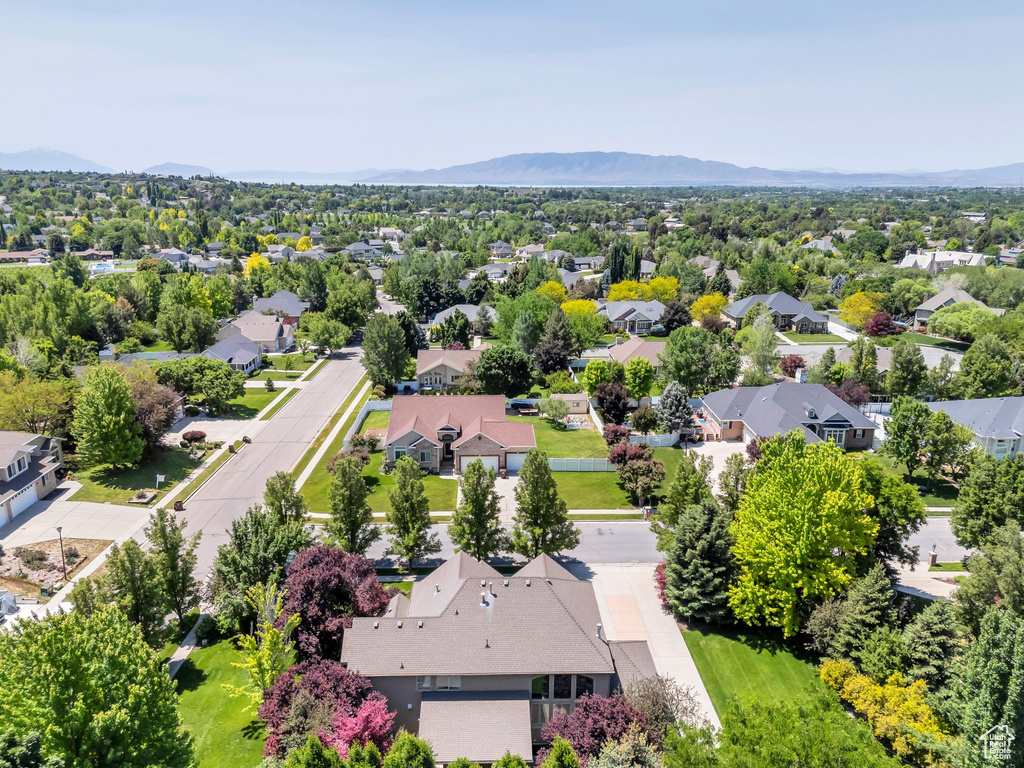 Aerial perspective of suburban area with a mountainous background