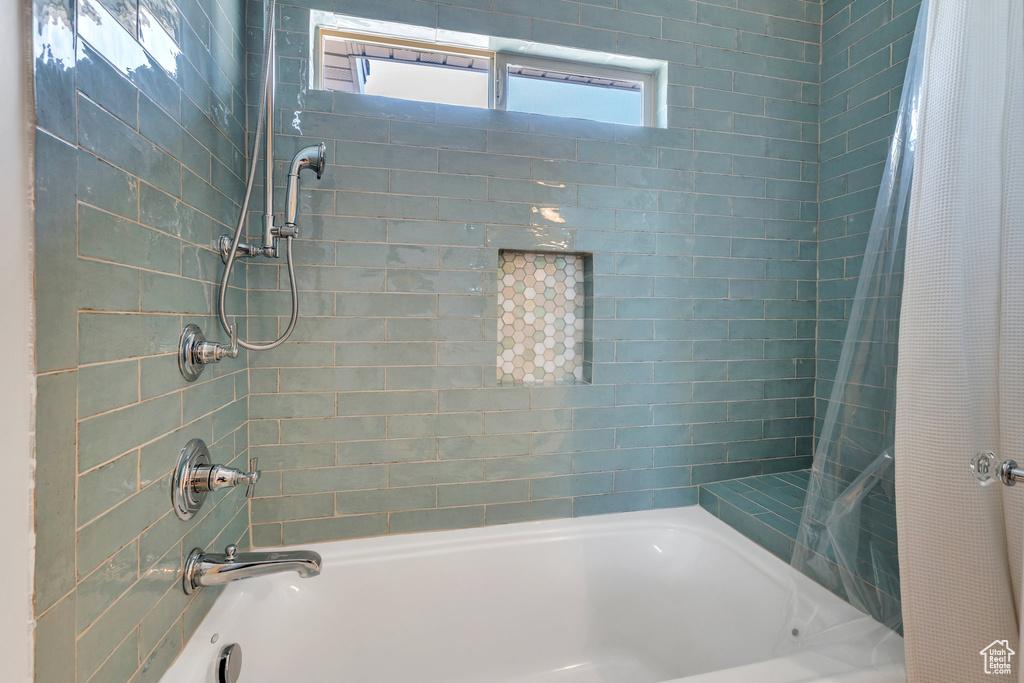 Full bathroom featuring shower / bath combination with curtain