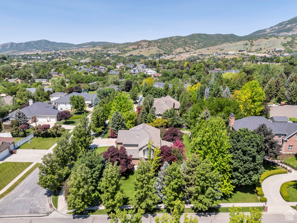 Aerial perspective of suburban area featuring a mountain backdrop