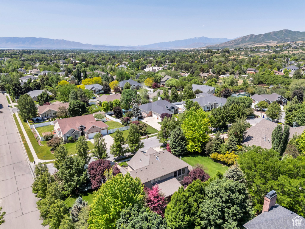 Aerial view of residential area featuring mountains
