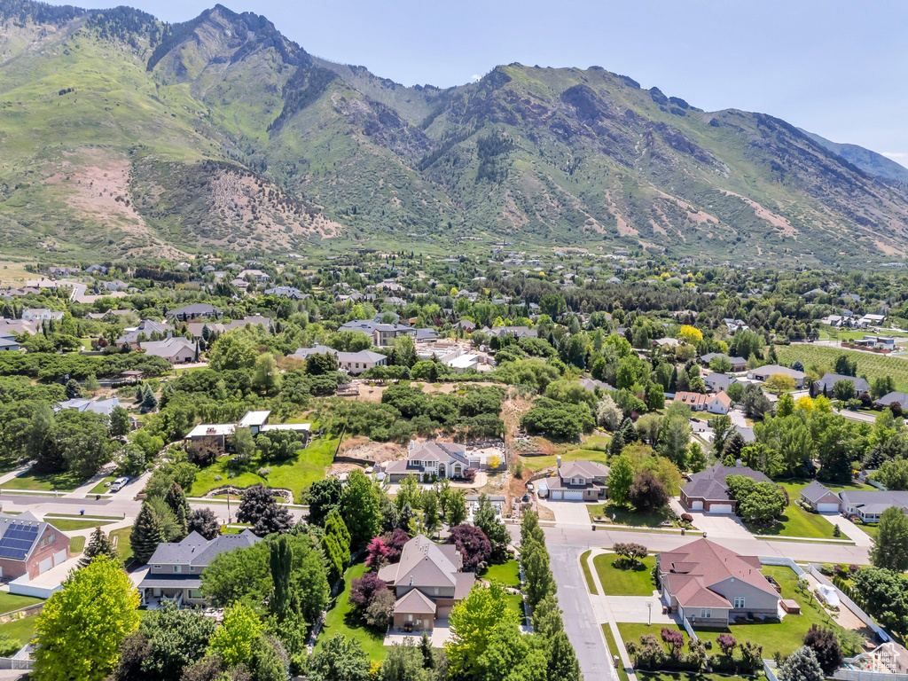 Aerial view of residential area featuring mountains