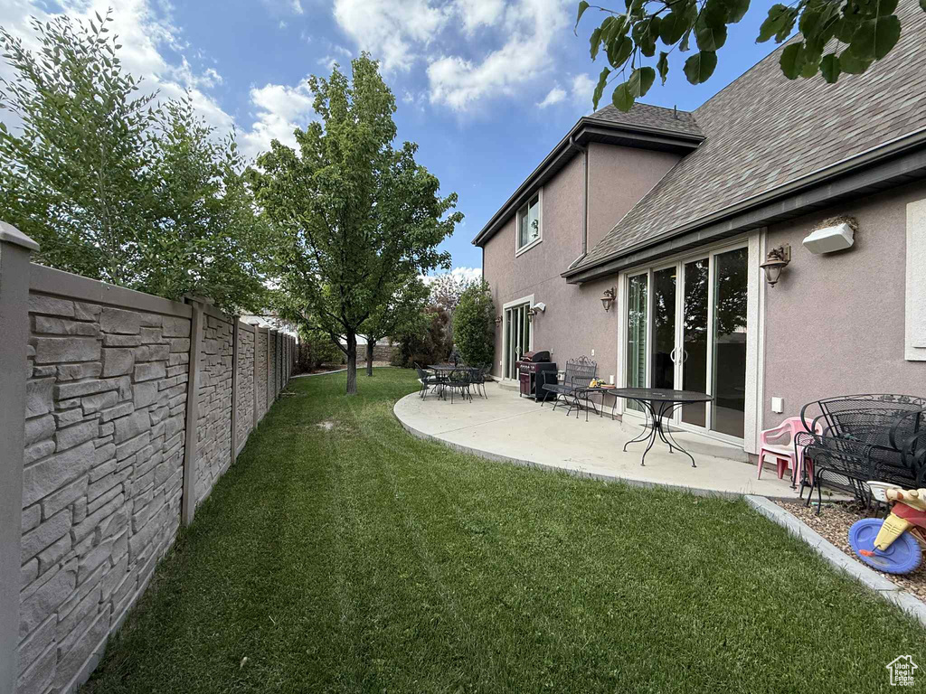 View of yard with a patio
