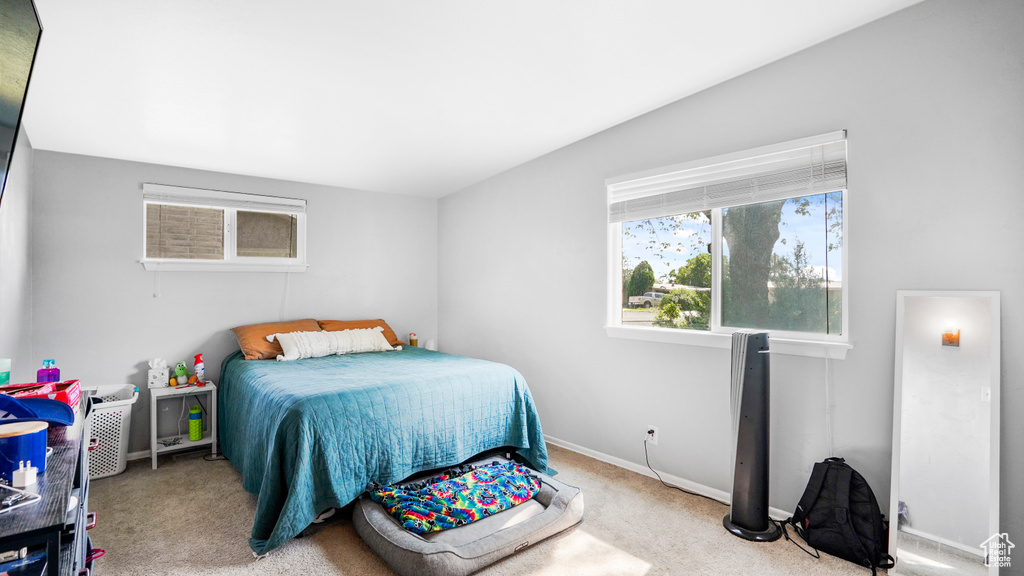 Carpeted bedroom featuring baseboards