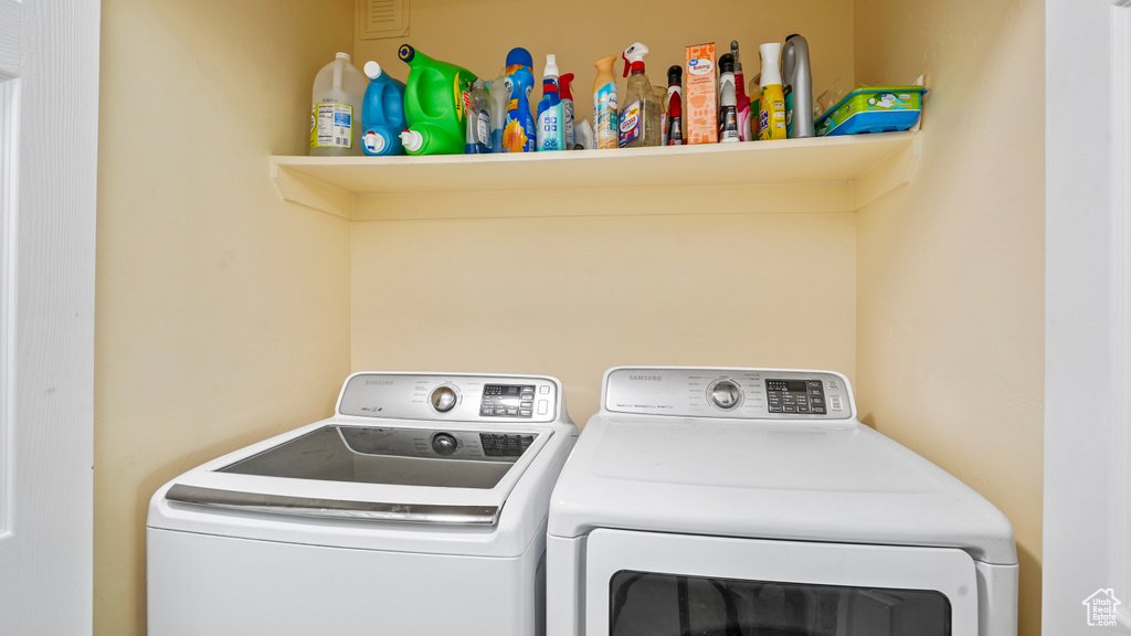 Washroom featuring independent washer and dryer
