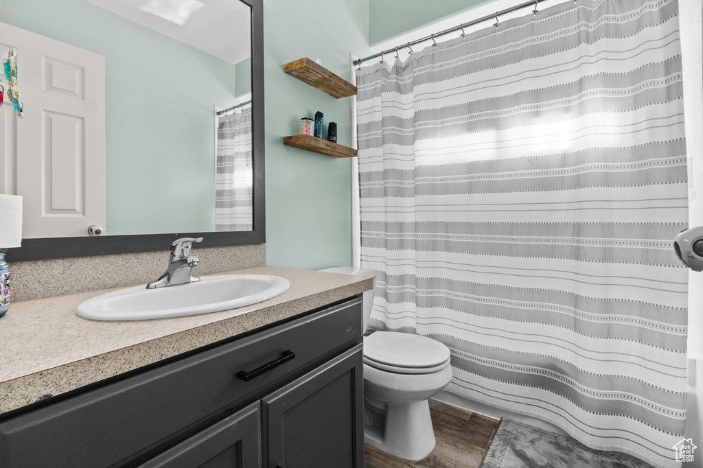 Bathroom featuring vanity and toilet