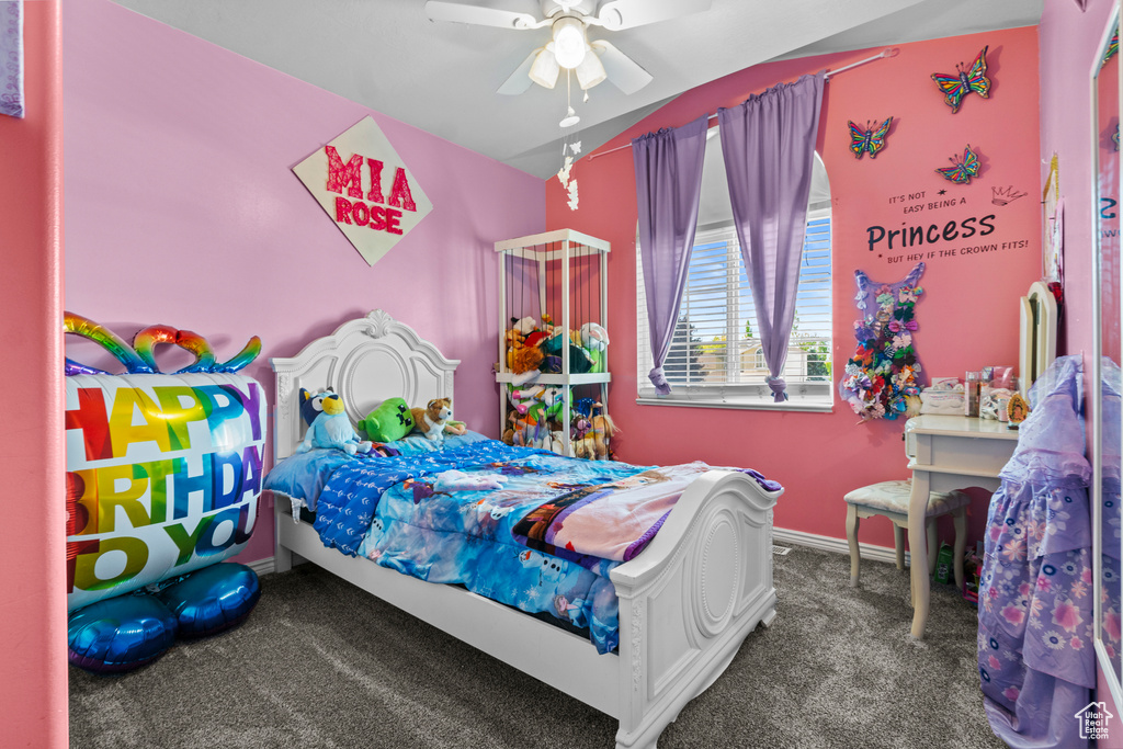 Carpeted bedroom with baseboards, a ceiling fan, and vaulted ceiling