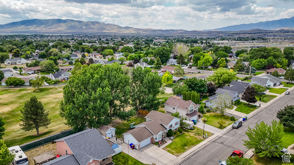 Aerial perspective of suburban area with a mountainous background