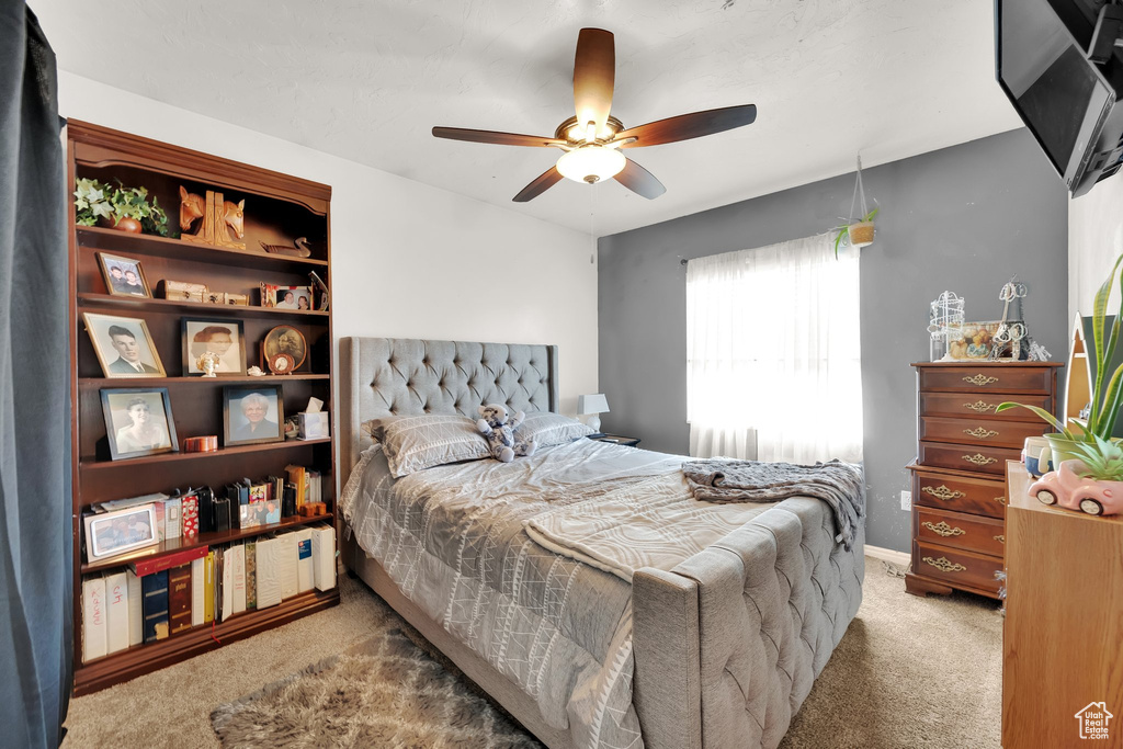 Bedroom featuring carpet flooring and ceiling fan