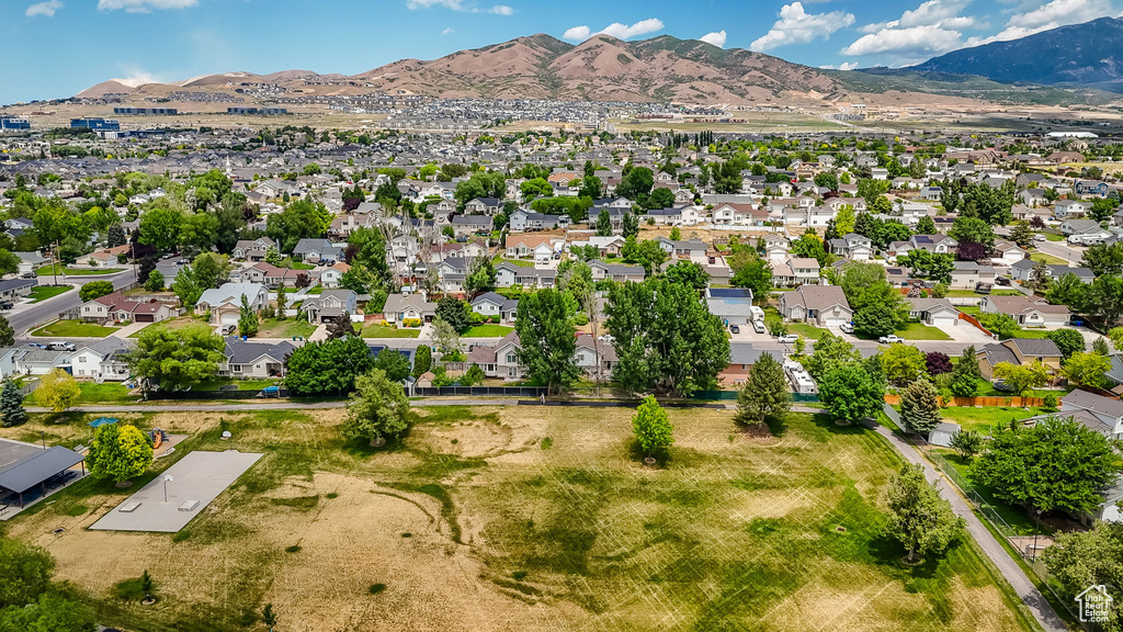 View of property location with a mountainous background and nearby suburban area