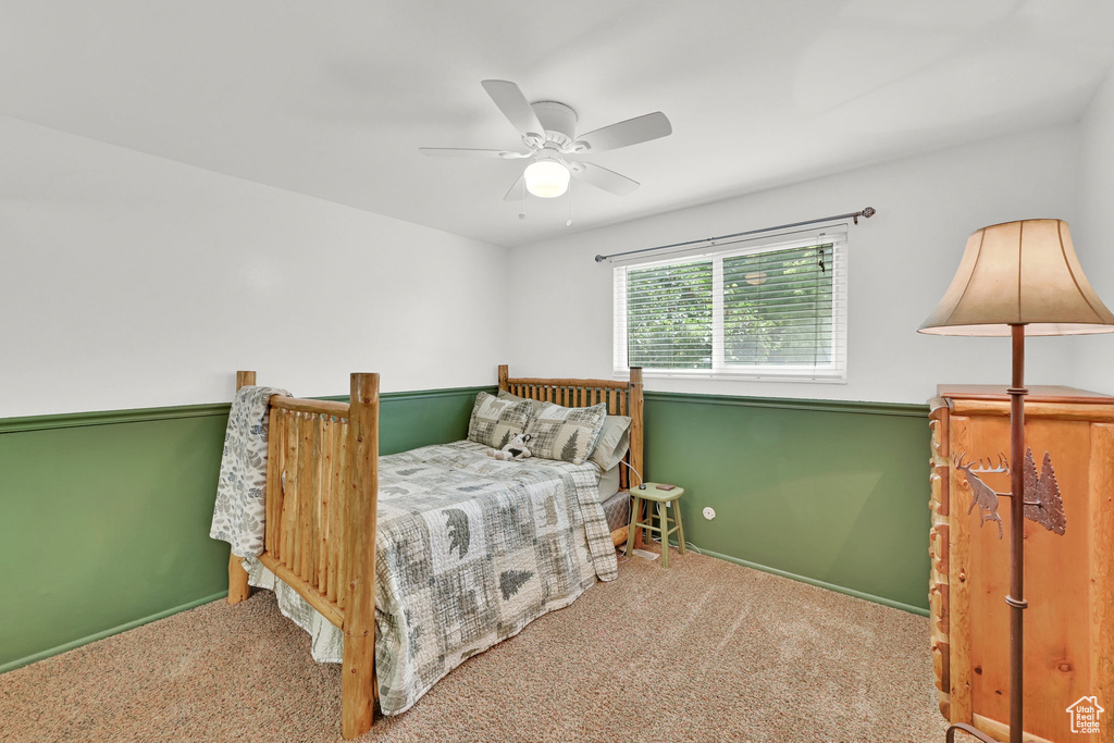 Bedroom featuring carpet floors and ceiling fan