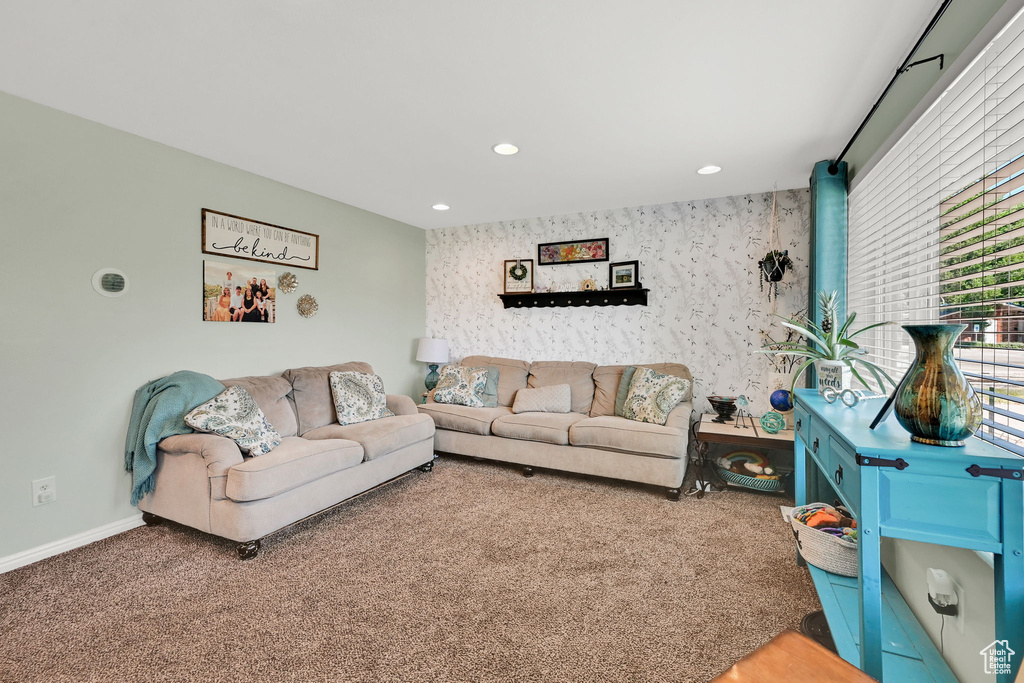Living room with recessed lighting, baseboards, and carpet flooring