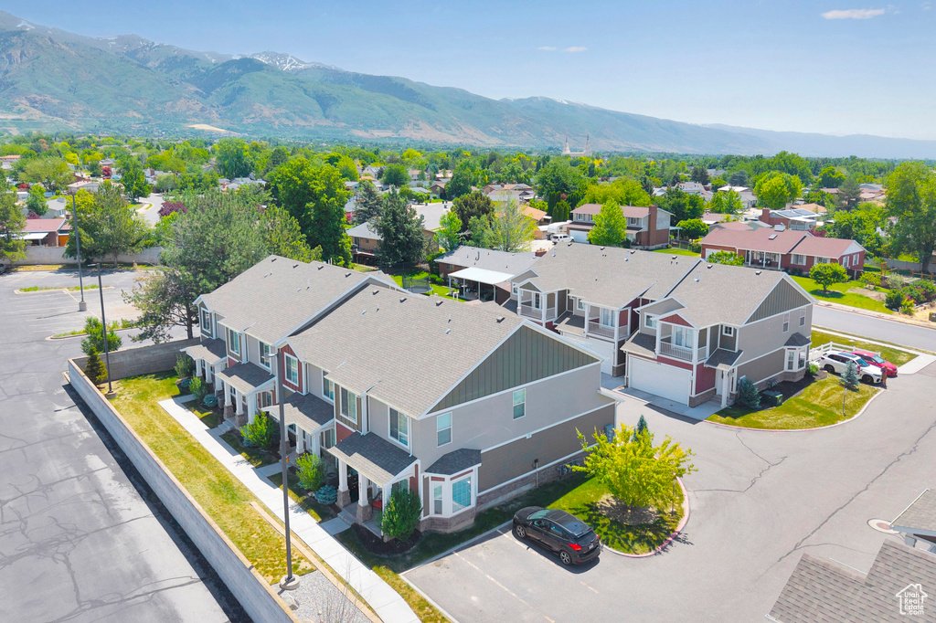 Aerial perspective of suburban area featuring a mountainous background