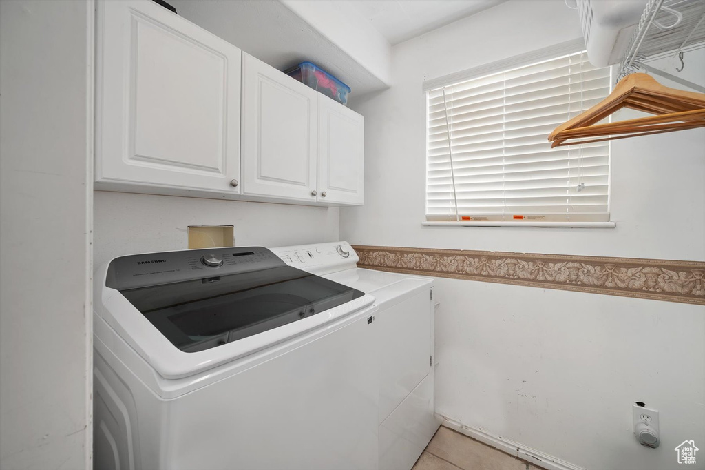 Washroom with independent washer and dryer and cabinet space