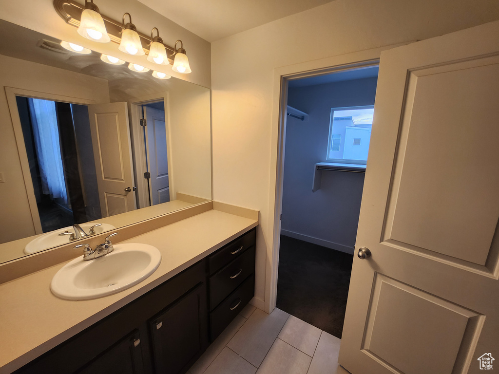 Bathroom with vanity and tile patterned floors