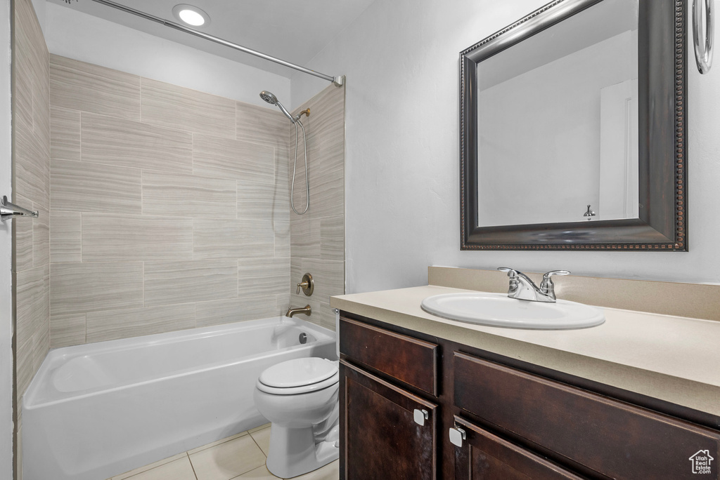 Full bathroom with shower / bathtub combination, tile patterned flooring, and vanity