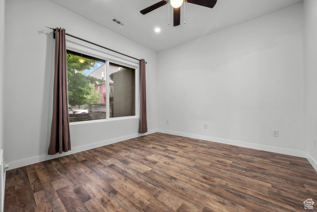 Unfurnished room with ceiling fan, wood finished floors, and recessed lighting
