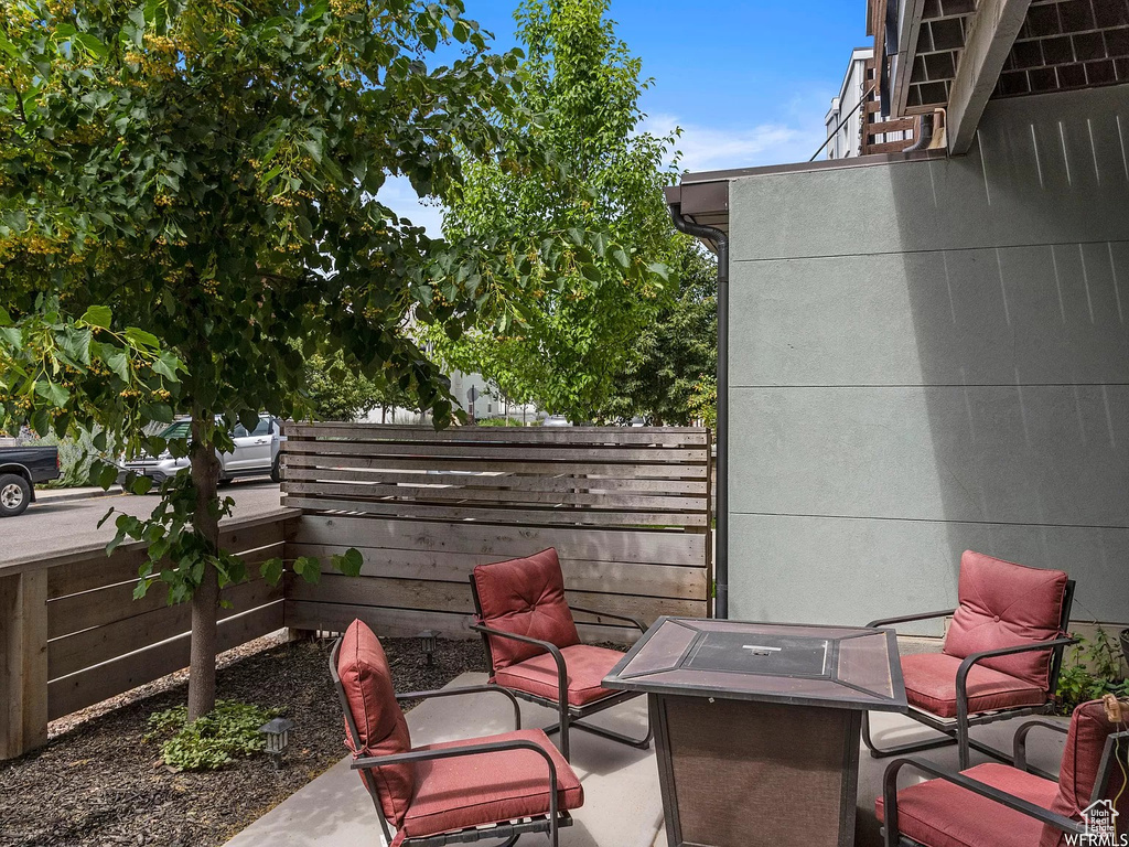 View of patio featuring a fire pit