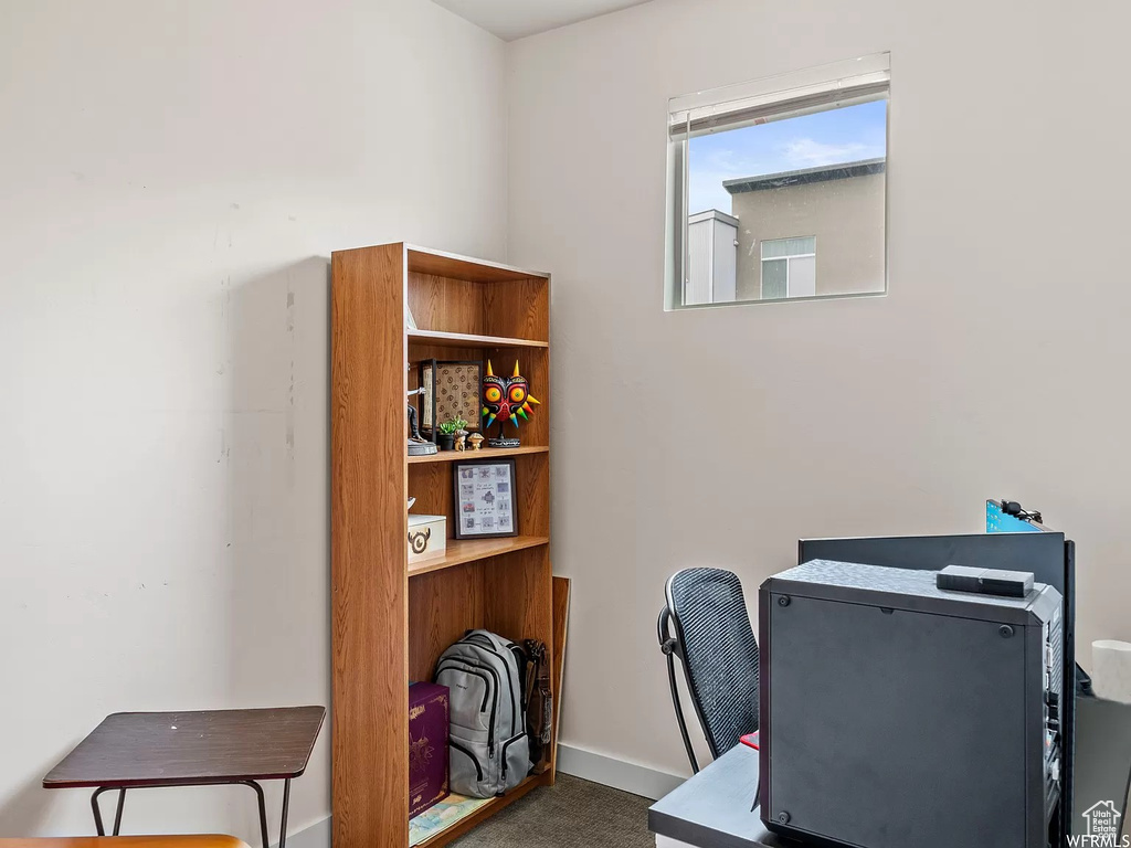 Office space featuring carpet flooring and baseboards