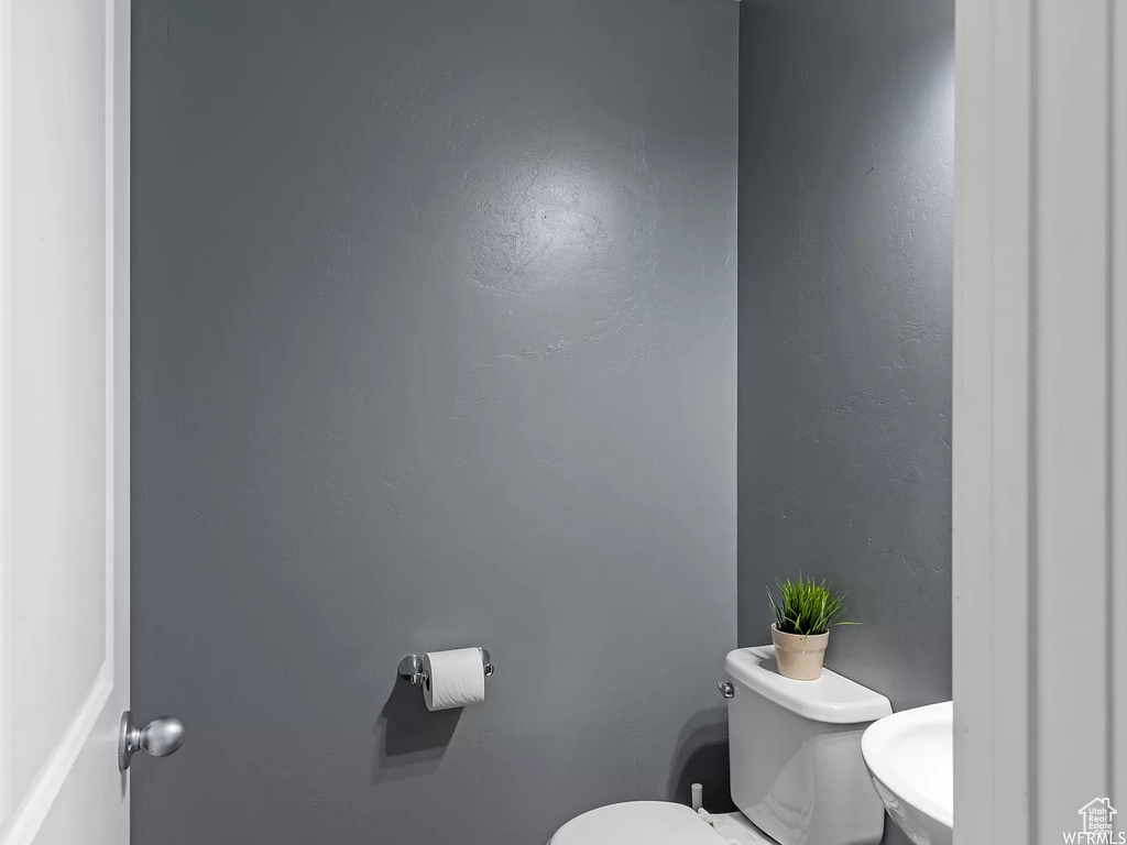 Half bathroom featuring toilet