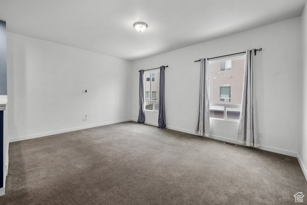 Spare room featuring carpet flooring