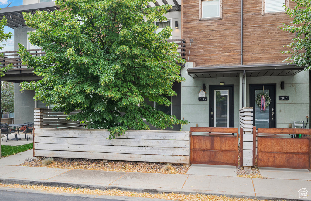 View of front of house featuring a porch and a balcony