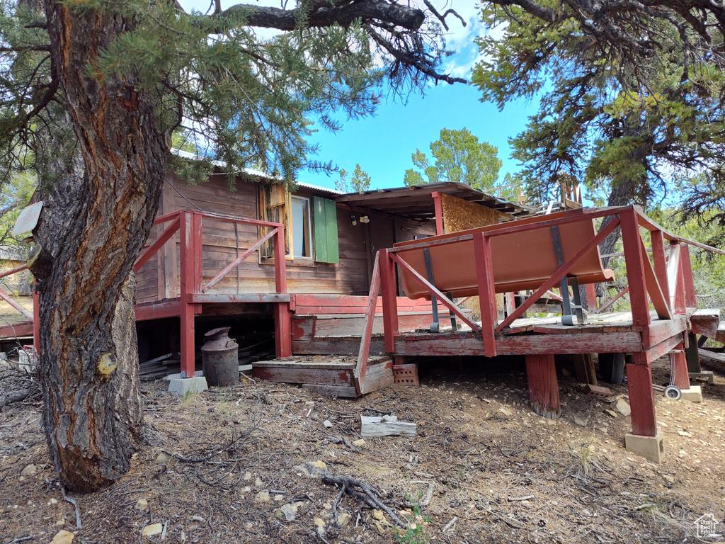 Back of property with a wooden deck