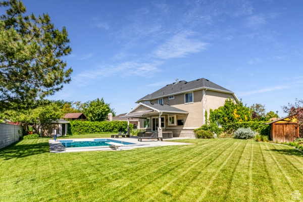 Back of property featuring a patio area and stucco siding