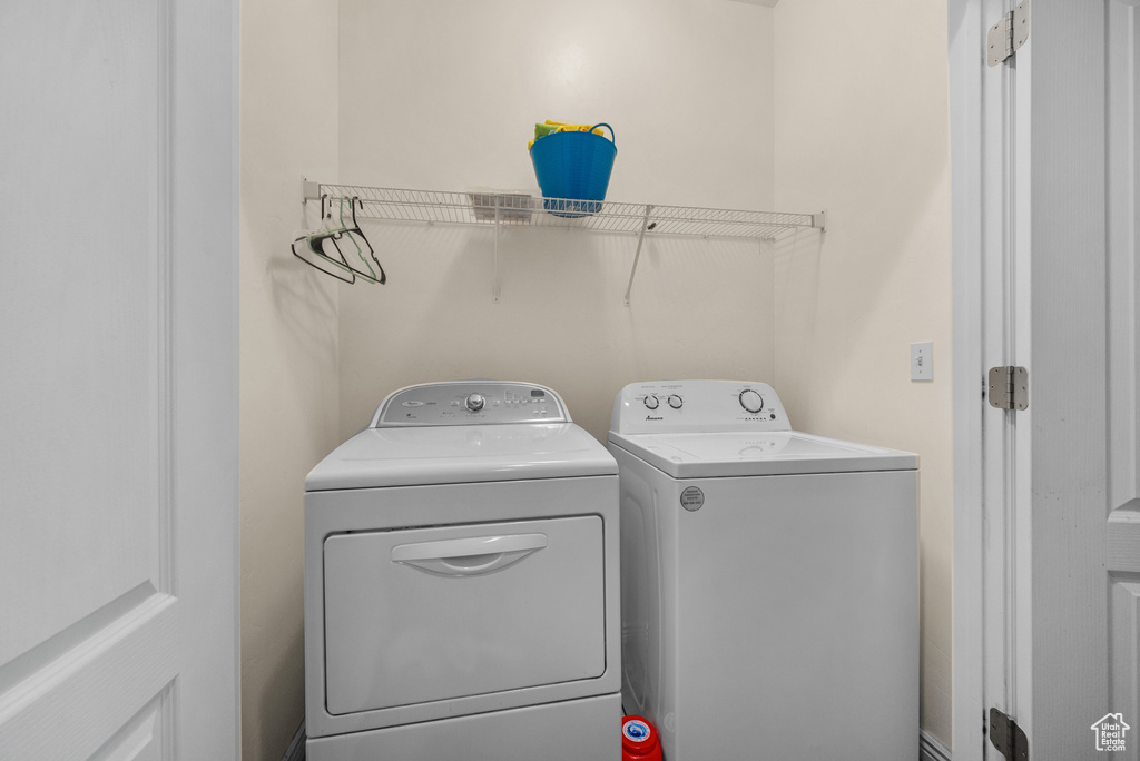 Laundry area with washer and clothes dryer