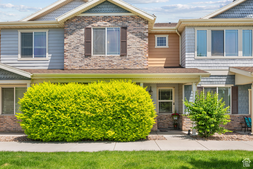 View of front of house featuring brick siding
