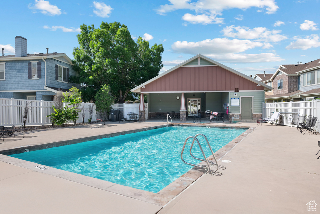Community pool featuring a patio area
