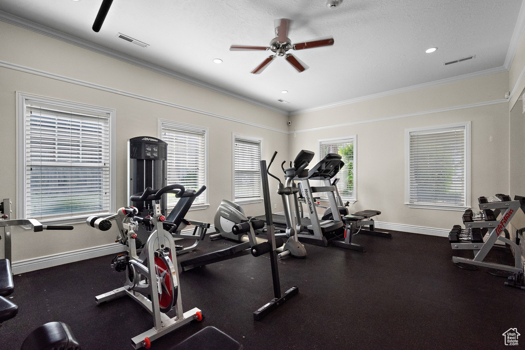 Workout area featuring a ceiling fan, baseboards, ornamental molding, and recessed lighting