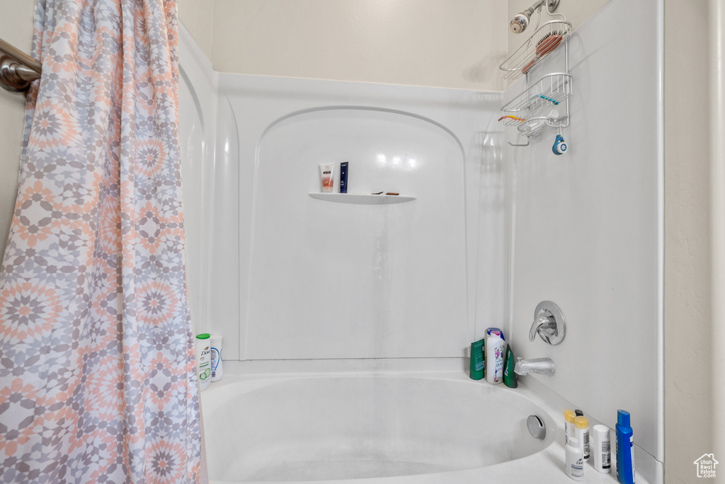 Bathroom with shower / bath combo with shower curtain
