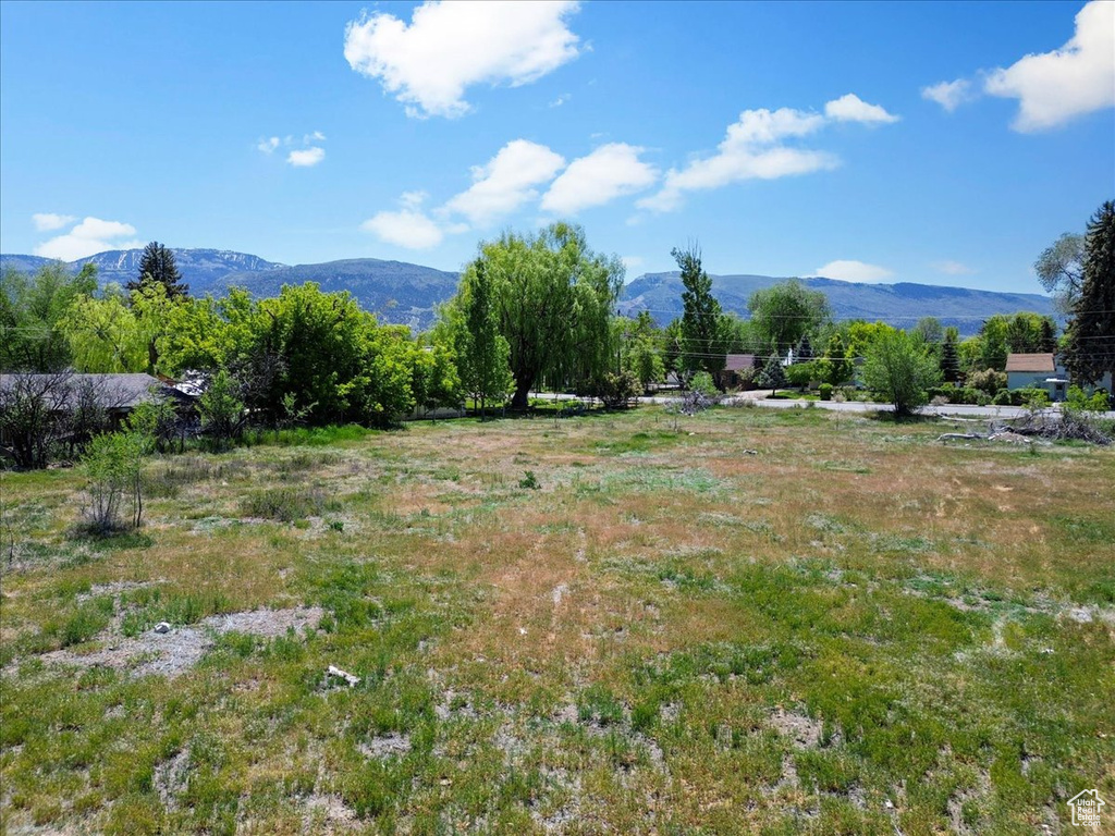 View of mountain background featuring rural landscape
