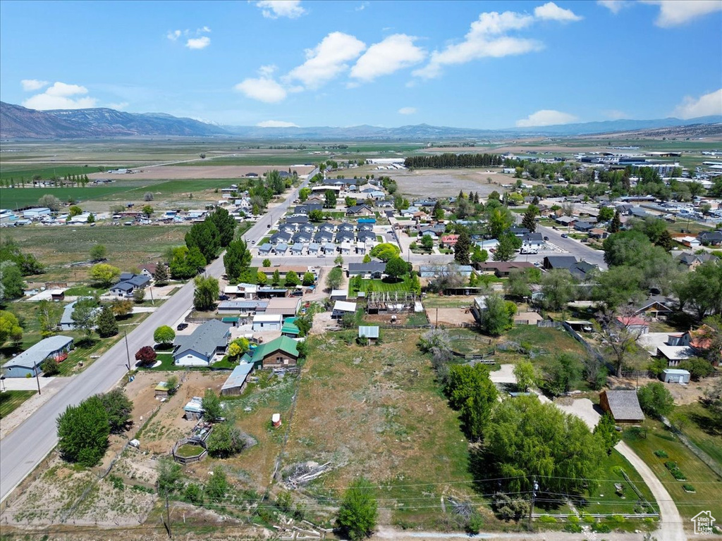 View of property location with a mountain backdrop and nearby suburban area